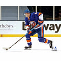 Noah Dobson New York Islanders Unsigned Blue Jersey Skating with Puck vs. Boston Bruins Photograph